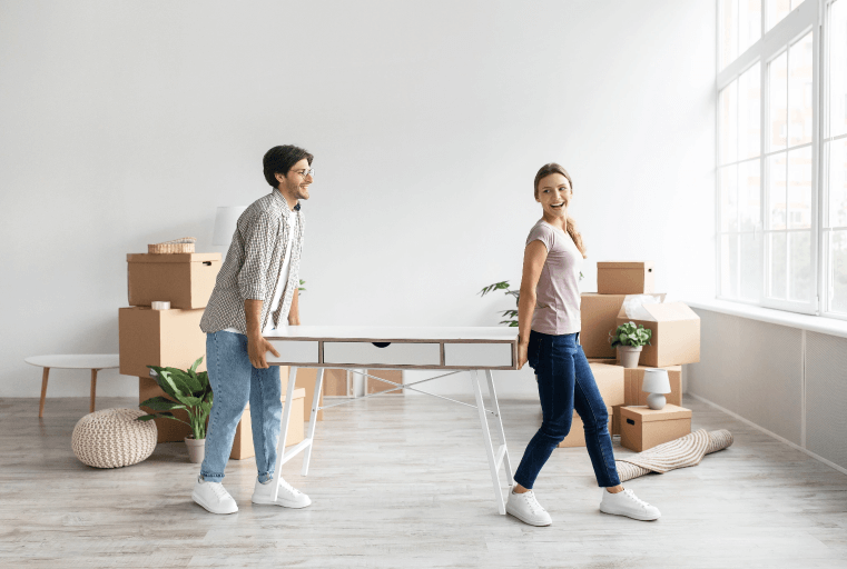 Cheerful couple preparing for a long distance move.